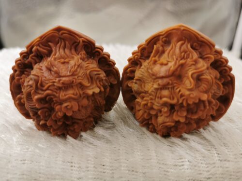 Two dragons play with a pearl